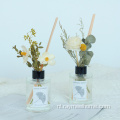 Ronde fles riet diffuser met boeketbloemen
